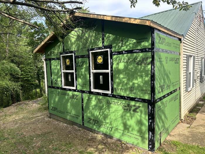New addition sheathed in taped ZIP System panels with the windows set