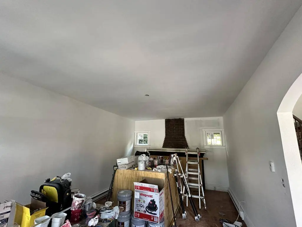 Original parquet flooring showing water damage before restoration