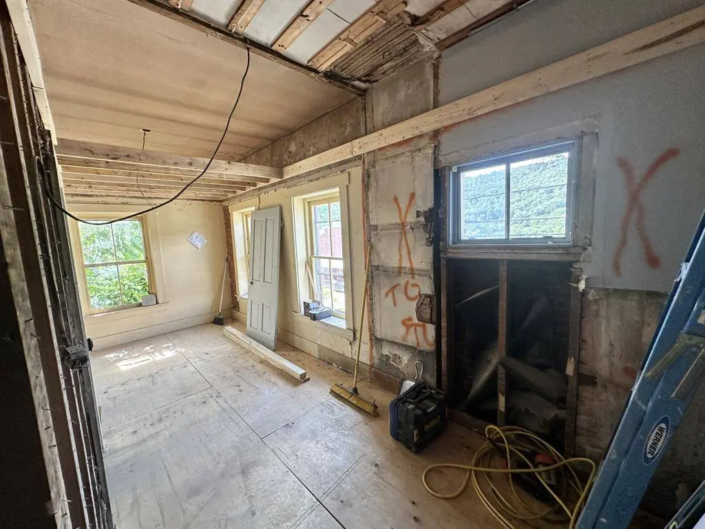 Interior stripped back to original brick and framing during the restoration