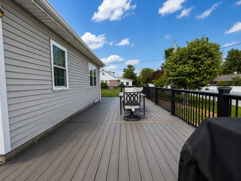 Finished deck surface with outdoor furniture in place