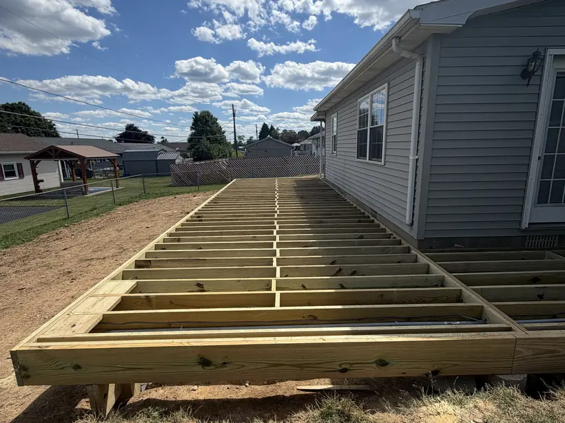 Pressure-treated deck frame with joists set, before decking