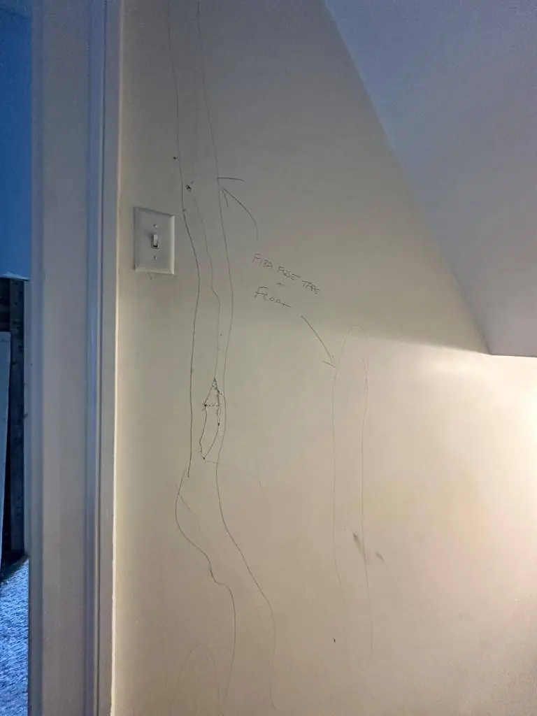 Cracks in the original horsehair plaster marked in pencil with the repair method noted before patching